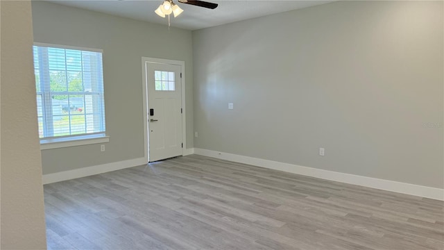 6345 SW 155th Pl, Ocala, FL 34473 - entrance foyer with wood finished floors, ceiling fan, and baseboards