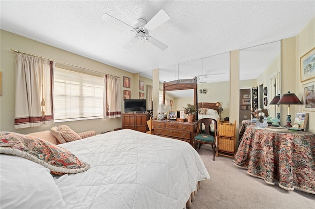 908 Hillary Ct Unit 15, Orlando, FL 32804 - carpeted bedroom with a textured ceiling and ceiling fan