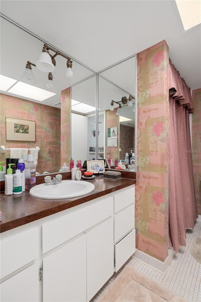 908 Hillary Ct Unit 15, Orlando, FL 32804 - bathroom with vanity, tile patterned flooring, and a shower with curtain