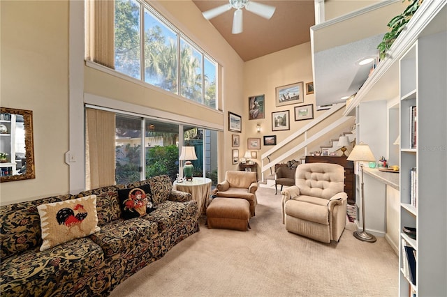 908 Hillary Ct Unit 15, Orlando, FL 32804 - living room with a high ceiling, carpet flooring, a ceiling fan, and stairway