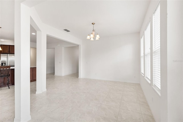3936 Parkhouse Dr, Orlando, FL 32824 - unfurnished room featuring visible vents and a chandelier