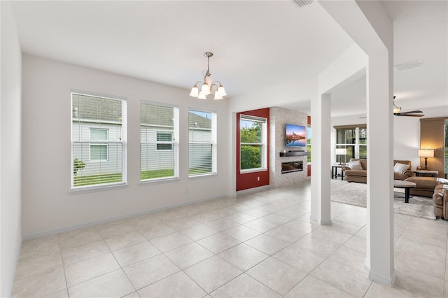 3936 Parkhouse Dr, Orlando, FL 32824 - unfurnished dining area featuring light tile patterned flooring, ceiling fan with notable chandelier, baseboards, and visible vents