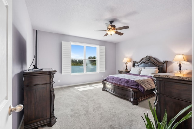 3936 Parkhouse Dr, Orlando, FL 32824 - bedroom with baseboards, ceiling fan, carpet floors, and a textured ceiling