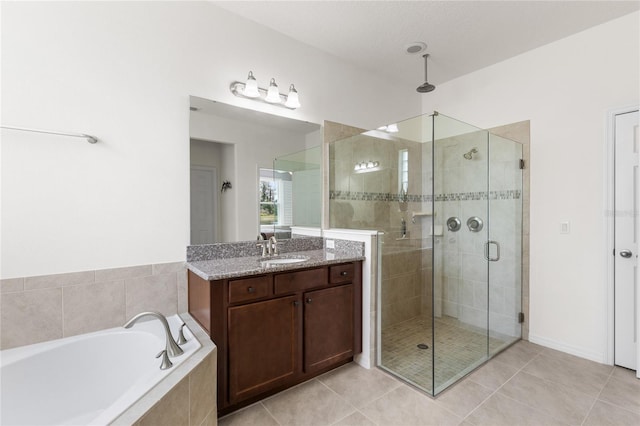 3936 Parkhouse Dr, Orlando, FL 32824 - bathroom with tile patterned flooring, vanity, a stall shower, and a garden tub