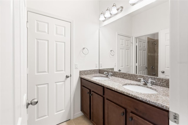 3936 Parkhouse Dr, Orlando, FL 32824 - bathroom with double vanity, a sink, tile patterned floors, and a shower
