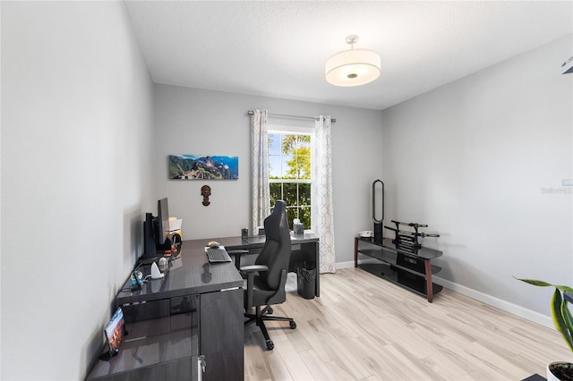 3936 Parkhouse Dr, Orlando, FL 32824 - home office featuring baseboards and wood finished floors