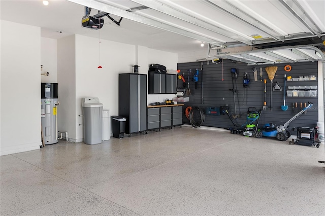 3936 Parkhouse Dr, Orlando, FL 32824 - garage with water heater, a garage door opener, and a workshop area