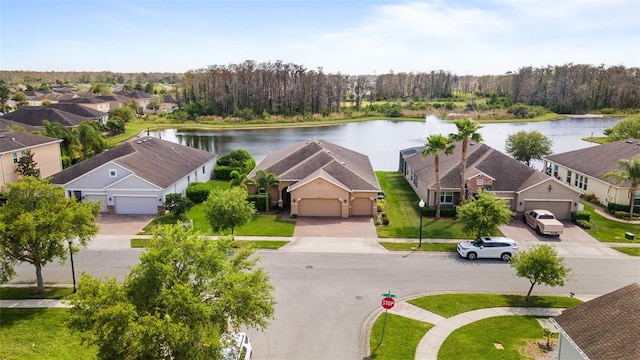3936 Parkhouse Dr, Orlando, FL 32824 - drone / aerial view featuring a residential view and a water view