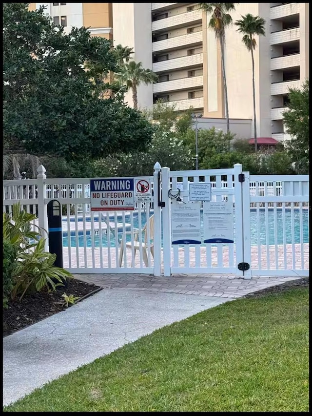 view of gate with fence