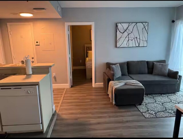 living room featuring baseboards and wood finished floors