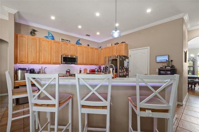 625 Waterland Ct, Orlando, FL 32828 - kitchen with a center island with sink, crown molding, arched walkways, and appliances with stainless steel finishes