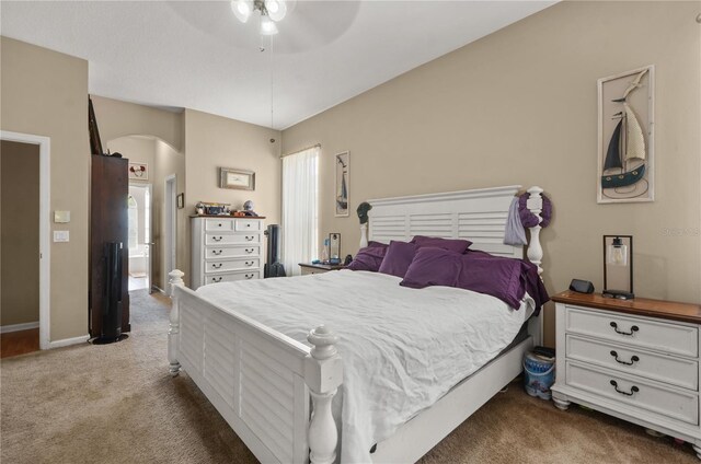 625 Waterland Ct, Orlando, FL 32828 - bedroom with baseboards, arched walkways, carpet floors, and a ceiling fan