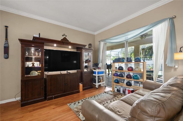 625 Waterland Ct, Orlando, FL 32828 - living room with ornamental molding, baseboards, and wood finished floors