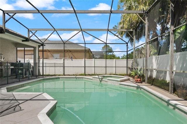 625 Waterland Ct, Orlando, FL 32828 - view of swimming pool featuring glass enclosure, fence, a pool with connected hot tub, and a patio area