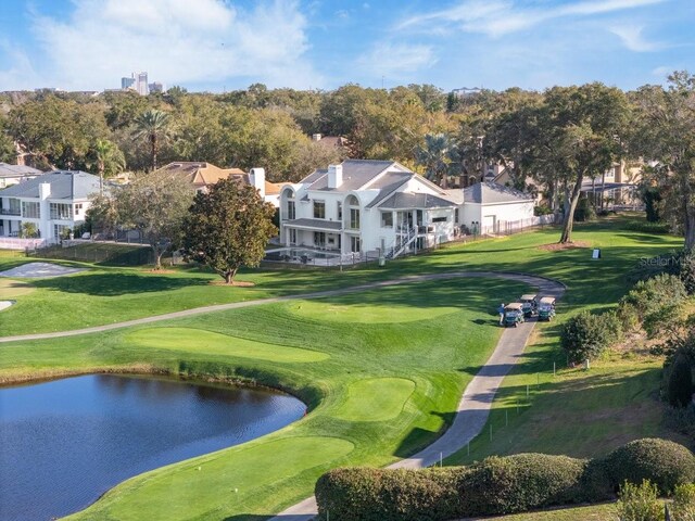 9000 Shawn Park Pl, Orlando, FL 32819 - view of home's community featuring golf course view, a water view, and a yard