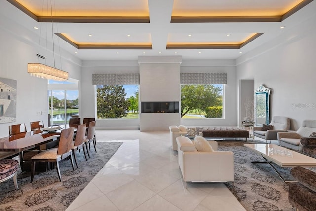 9000 Shawn Park Pl, Orlando, FL 32819 - interior space featuring coffered ceiling, recessed lighting, a high ceiling, light tile patterned flooring, and a multi sided fireplace