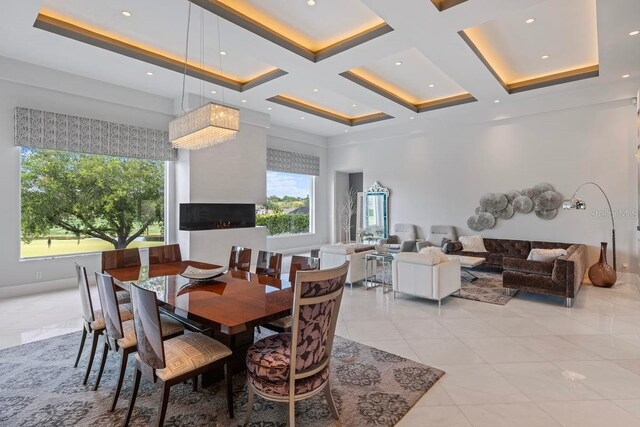 9000 Shawn Park Pl, Orlando, FL 32819 - dining space with coffered ceiling, beam ceiling, a towering ceiling, and light tile patterned floors