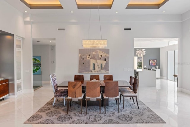 9000 Shawn Park Pl, Orlando, FL 32819 - dining space featuring a high ceiling, coffered ceiling, a chandelier, and visible vents
