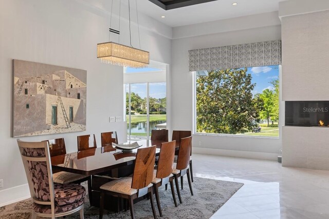 9000 Shawn Park Pl, Orlando, FL 32819 - dining room with baseboards and tile patterned flooring