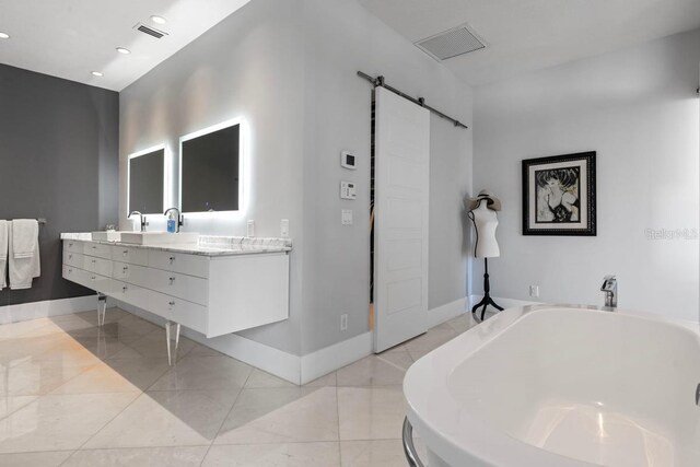 9000 Shawn Park Pl, Orlando, FL 32819 - full bathroom featuring double vanity, visible vents, baseboards, and a bath
