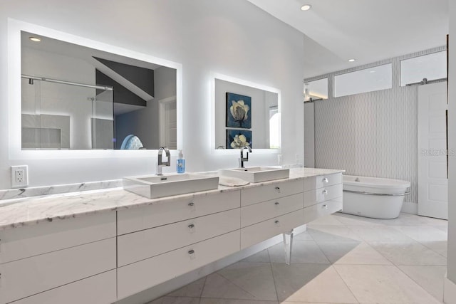 9000 Shawn Park Pl, Orlando, FL 32819 - bathroom featuring tile patterned flooring, vanity, walk in shower, and recessed lighting