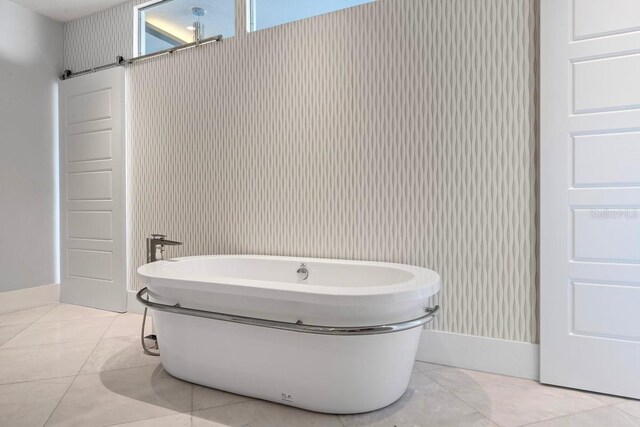 9000 Shawn Park Pl, Orlando, FL 32819 - full bathroom with a freestanding tub and tile patterned flooring