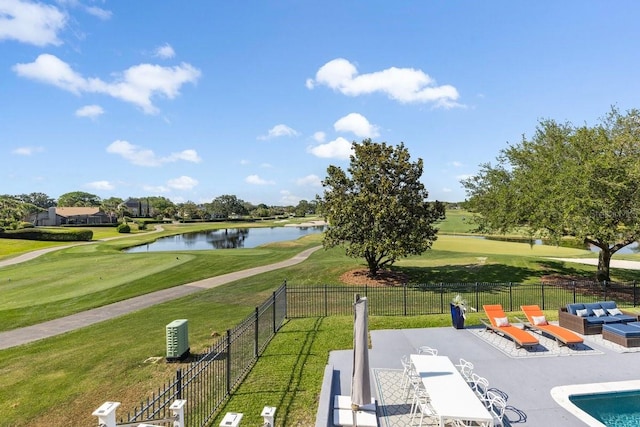 9000 Shawn Park Pl, Orlando, FL 32819 - exterior space with a patio area, fence, golf course view, a lawn, and a water view