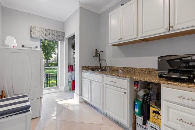 9000 Shawn Park Pl, Orlando, FL 32819 - kitchen featuring light tile patterned floors, white cabinets, a sink, and ornamental molding