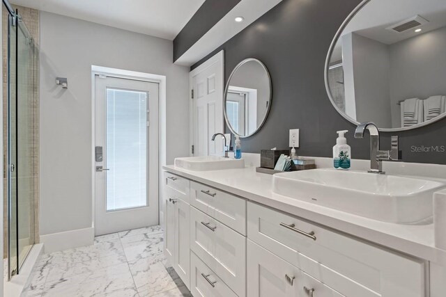 9000 Shawn Park Pl, Orlando, FL 32819 - full bath with marble finish floor, visible vents, a sink, and a stall shower