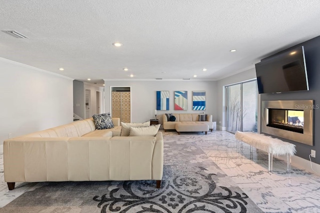 9000 Shawn Park Pl, Orlando, FL 32819 - living area with a textured ceiling, visible vents, ornamental molding, recessed lighting, and a glass covered fireplace