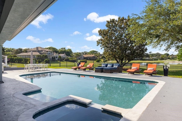 9000 Shawn Park Pl, Orlando, FL 32819 - view of pool featuring fence, a pool with connected hot tub, a patio, and a yard