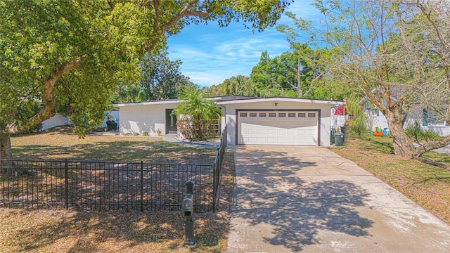701 Denton Rd, Winter Park, FL 32792 - view of front of house featuring concrete driveway, a garage, fence, and a front lawn