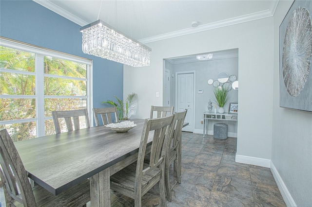 701 Denton Rd, Winter Park, FL 32792 - dining room featuring stone finish floor, crown molding, baseboards, and a chandelier