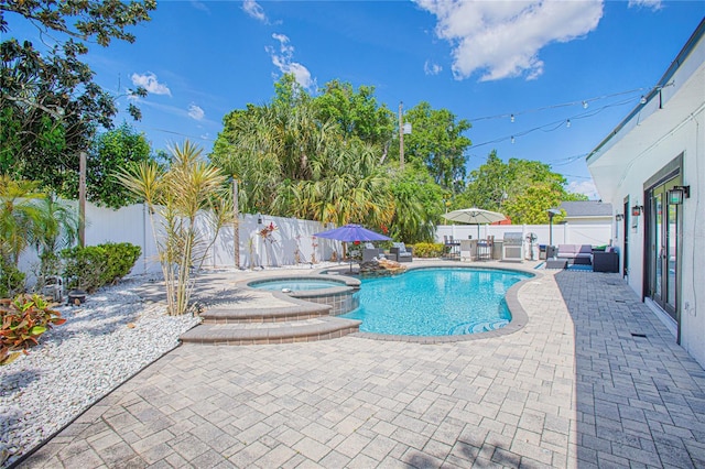 701 Denton Rd, Winter Park, FL 32792 - view of pool with a patio, a fenced backyard, and a pool with connected hot tub