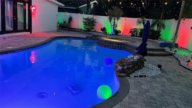701 Denton Rd, Winter Park, FL 32792 - view of pool with a fenced backyard, a pool with connected hot tub, and a patio area