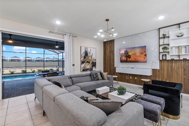 4305 Lana Ave, Davenport, FL 33897 - living area featuring light tile patterned floors, wood walls, and recessed lighting
