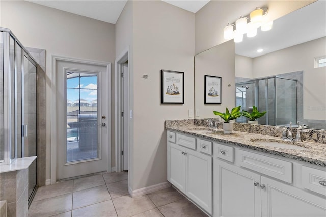 4305 Lana Ave, Davenport, FL 33897 - bathroom with a stall shower, a sink, tile patterned flooring, baseboards, and double vanity