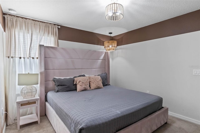 4305 Lana Ave, Davenport, FL 33897 - carpeted bedroom with baseboards and an inviting chandelier