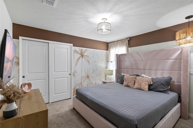4305 Lana Ave, Davenport, FL 33897 - carpeted bedroom featuring visible vents, a closet, and a textured ceiling