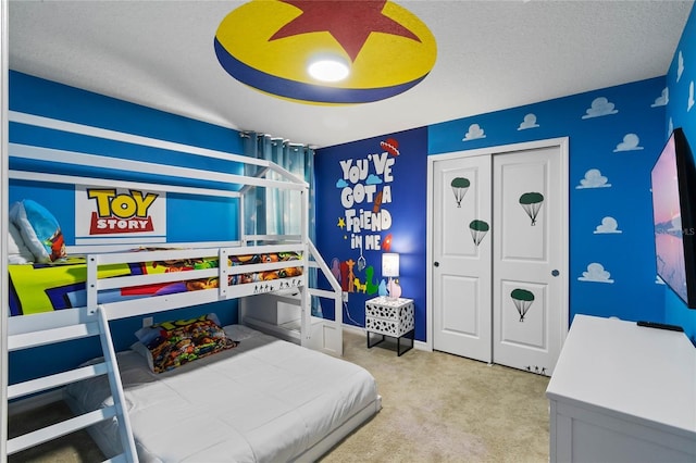 4305 Lana Ave, Davenport, FL 33897 - carpeted bedroom with baseboards, a closet, ceiling fan, and a textured ceiling