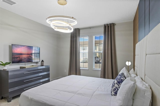 4305 Lana Ave, Davenport, FL 33897 - bedroom featuring visible vents and a chandelier