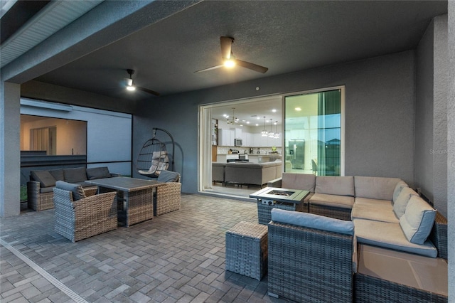 4305 Lana Ave, Davenport, FL 33897 - view of patio / terrace with ceiling fan and an outdoor living space with a fire pit