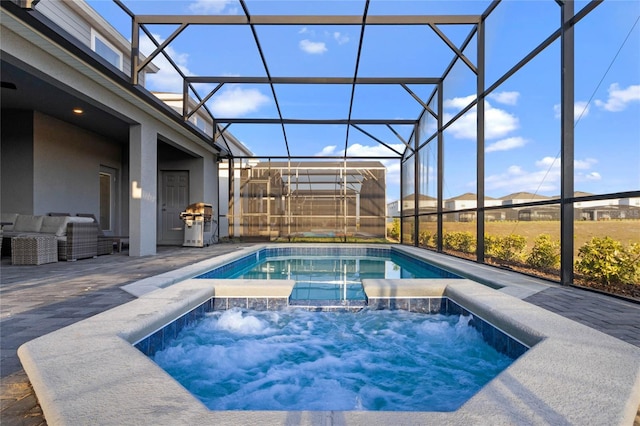 4305 Lana Ave, Davenport, FL 33897 - view of pool featuring glass enclosure, an outdoor living space, an in ground hot tub, and a patio area