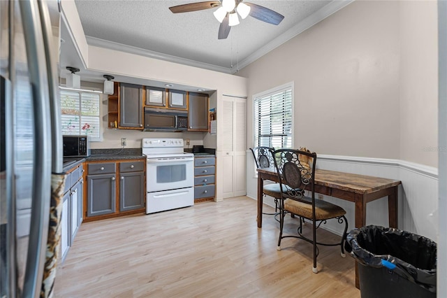 5813 Parkview Point Dr, Orlando, FL 32821 - kitchen with a textured ceiling, crown molding, white electric stove, black microwave, and open shelves