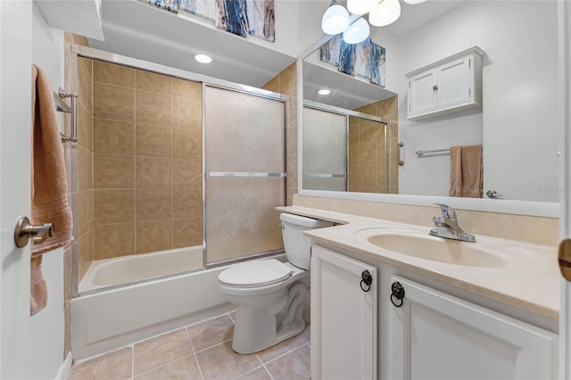 5813 Parkview Point Dr, Orlando, FL 32821 - bathroom featuring tile patterned floors, vanity, toilet, and bath / shower combo with glass door