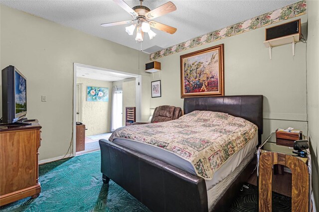 5813 Parkview Point Dr, Orlando, FL 32821 - bedroom featuring carpet flooring, baseboards, ceiling fan, and a textured ceiling