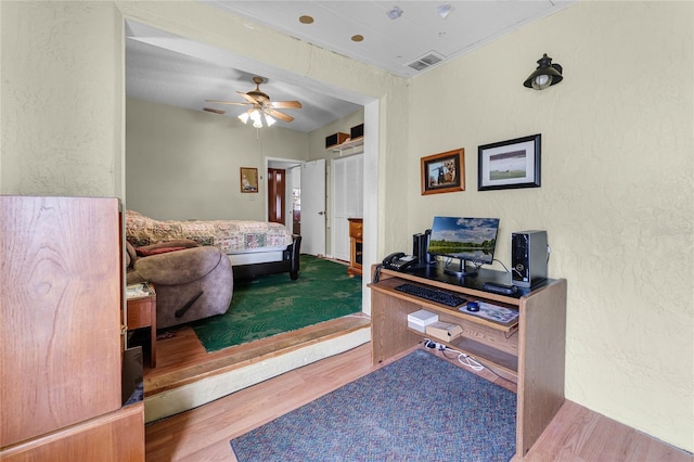 5813 Parkview Point Dr, Orlando, FL 32821 - bedroom with a textured wall, visible vents, wood finished floors, and a ceiling fan