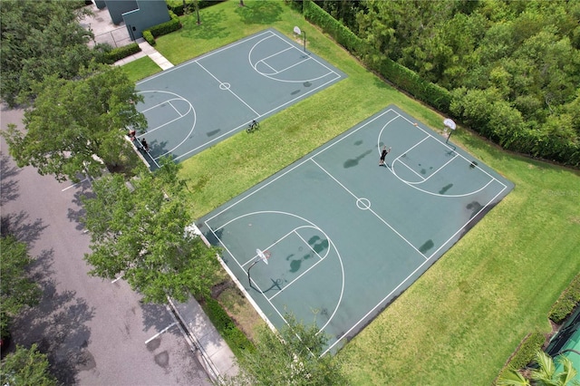 view of sport court with a lawn and community basketball court