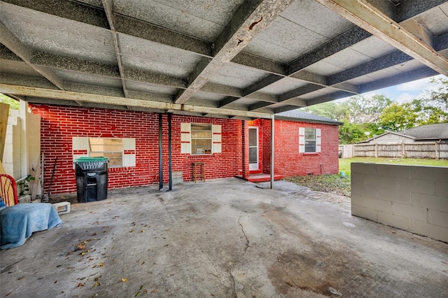 1413 36th St, Orlando, FL 32839 - view of patio featuring a carport and fence