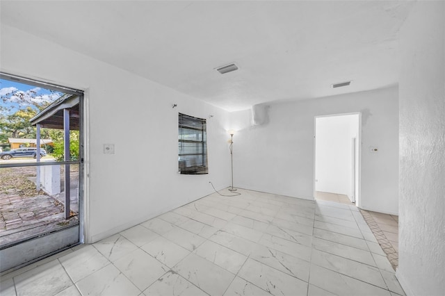 1413 36th St, Orlando, FL 32839 - empty room with marble finish floor and visible vents